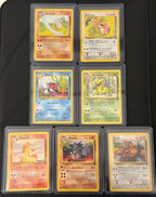 Actual english Pokémon cards — Marowak 39/64, Lickitung 38/64, Seaking 46/64, Victreebel 30/64, Rapidash 44/64, Rhydon 45/64, Tauros 47/64 — bundle photograph