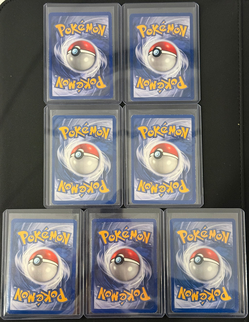 Actual english Pokémon cards — Marowak 39/64, Lickitung 38/64, Seaking 46/64, Victreebel 30/64, Rapidash 44/64, Rhydon 45/64, Tauros 47/64 — bundle photograph