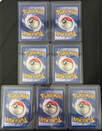 Actual english Pokémon cards — Marowak 39/64, Lickitung 38/64, Seaking 46/64, Victreebel 30/64, Rapidash 44/64, Rhydon 45/64, Tauros 47/64 — bundle photograph