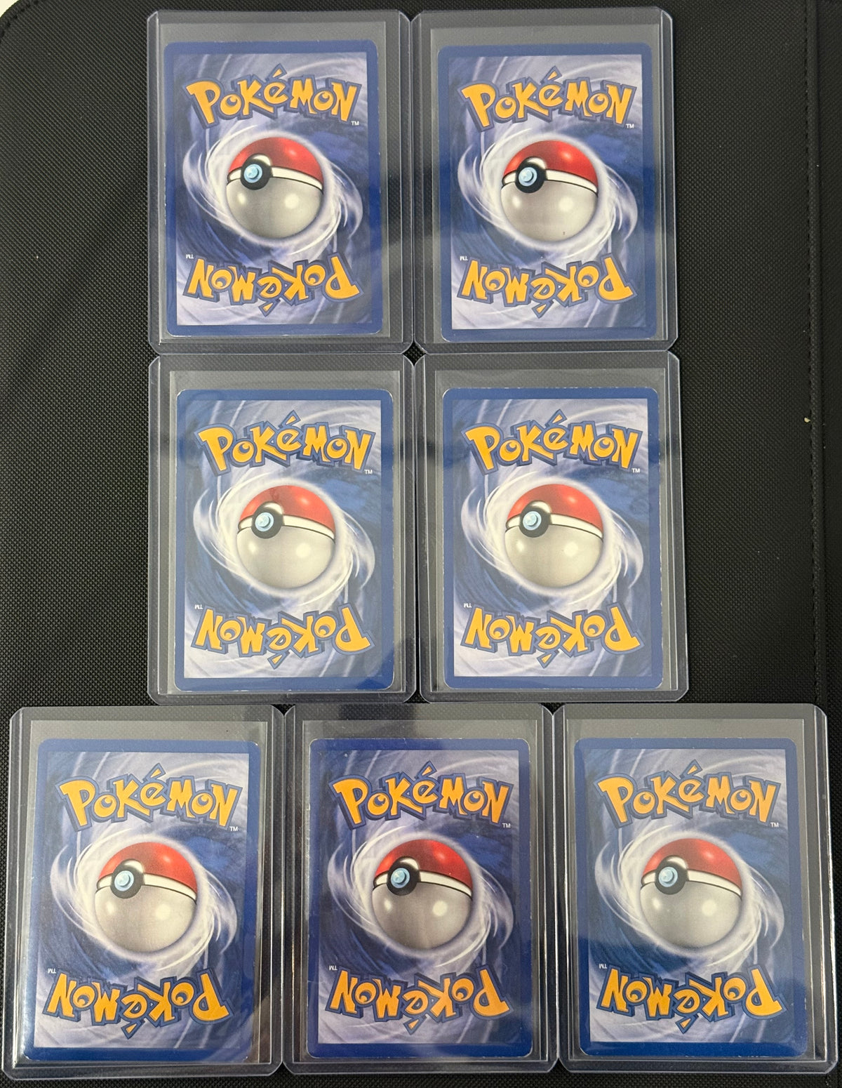 Actual english Pokémon cards — Marowak 39/64, Lickitung 38/64, Seaking 46/64, Victreebel 30/64, Rapidash 44/64, Rhydon 45/64, Tauros 47/64 — bundle photograph