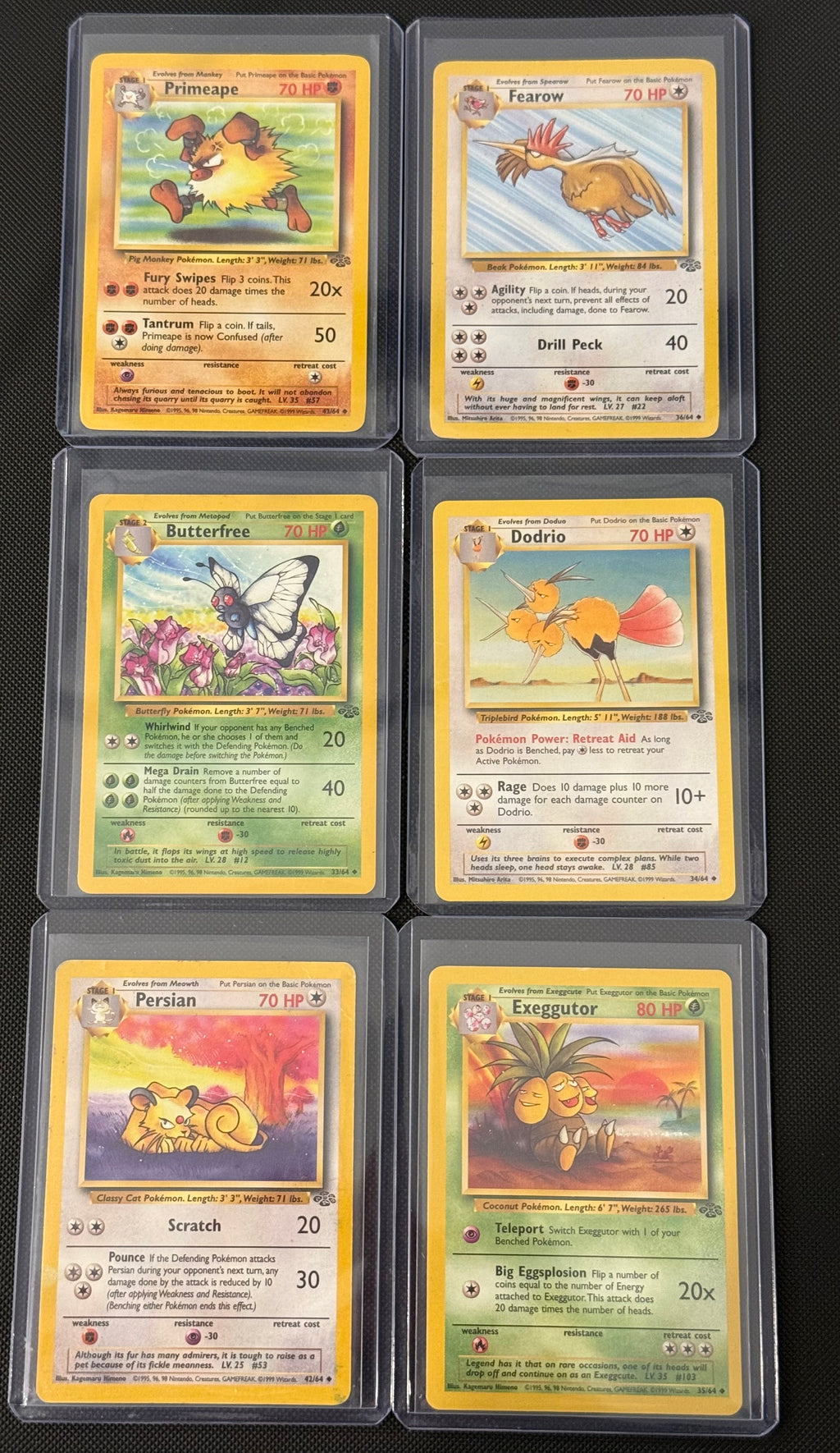 Actual english Pokémon cards — Primeape 43/64, Fearow 36/64, Butterfree 33/64, Dodrio 34/64, Persian 42/64, Exeggutor 35/64 — bundle photograph
