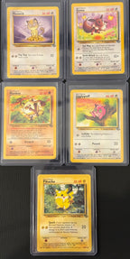 Actual english Pokémon cards — Pikachu 60/64, Eevee 51/64, Meowth 56/64, Mankey 55/64, Jigglypuff 54/64 — bundle photograph