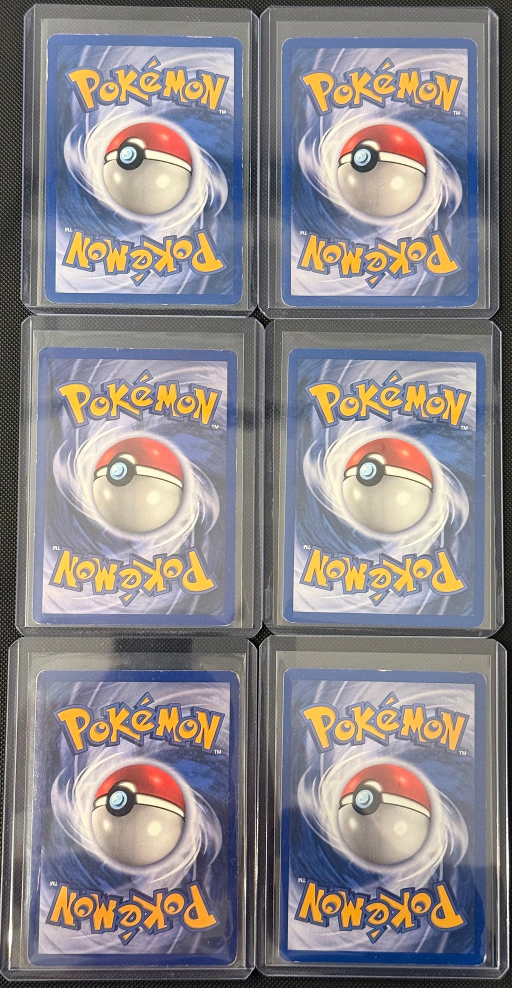 Actual english Pokémon cards — Primeape 43/64, Fearow 36/64, Butterfree 33/64, Dodrio 34/64, Persian 42/64, Exeggutor 35/64 — bundle photograph