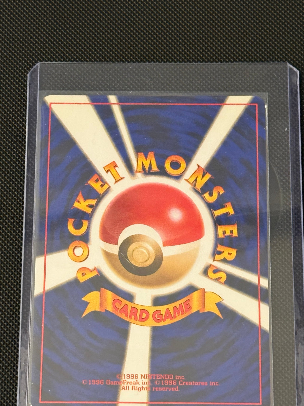 Japanese Fossil Raichu No. 026 holo — actual card back, photo 3927