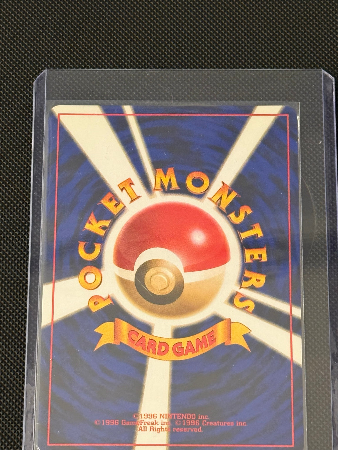 Japanese Fossil Raichu No. 026 holo — actual card back, photo 3928